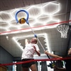 Volleyball athlete performing an attacking drill on an indoor training court at BAM BAM Training