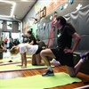 Young volleyball players participating in strength and athletic performance training at BAM BAM Training summer camp